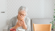 Why do elderly people often choke while eating, and how should they handle it?