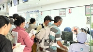 Missä Ho Chi Minh Cityn asukkaat rekisteröityvät ensimmäiseen sairausvakuutukseen fuusion jälkeen?