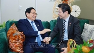 Premiärminister Pham Minh Chinh träffar Singapores premiärminister Lawrence.