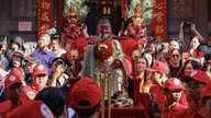 Crowds of people in Ho Chi Minh City escort the statue of Quan Thanh De Quan on a procession.