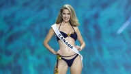 The 30-year-old beauty queen sparked controversy by posing in a swimsuit while four months pregnant.