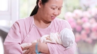 En kvinde i slutningen af ​​40'erne troede, at hun havde mistet chancen for at blive mor, og blev uventet gravid efter 18 års infertilitet.