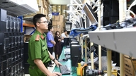 Images show police conducting emergency searches of companies suspected of using pirated Windows and Microsoft Office.