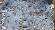 The aluminum plate is engraved with the name "Le Hong Ngu".