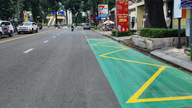 The bus stop is painted with reflective blue paint to increase visibility.
