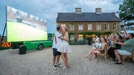 The bride secretly set up a 210-inch screen so the groom could watch football right at the wedding.