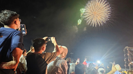 People in the coastal city of Vung Tau braved the rain to watch fireworks celebrating the 50th anniversary of the city being named after President Ho Chi Minh.