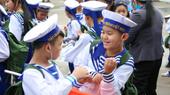 Wearing navy uniforms, the "little soldiers" of Da Nang learn to live independently.
