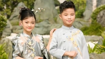 Bé Ghến phim "Đi giữa trời rực rỡ" xinh xắn trong tà áo dài
