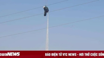 Người đàn ông nhảy dù mắc vào dây điện, treo lơ lửng hơn 1 giờ
