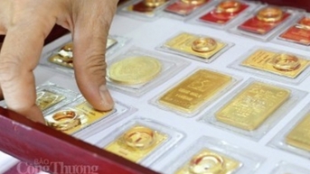 Vàng thế giới giảm nhẹ khi đồng USD kìm hãm đà tăng