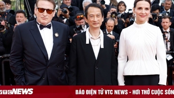 Trần Anh Hùng ôm hôn vợ giữa tràng vỗ tay kéo dài 7 phút tại Cannes