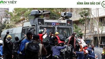 Protesters climb on water cannon truck, burn down parliament in Kenya