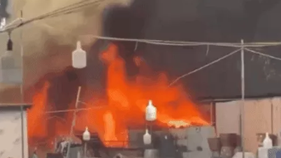 Temporary shelter burns fiercely in the intense heat in Hanoi
