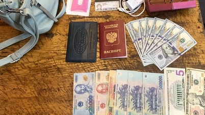 Western tourist happily receives money and passport left on train