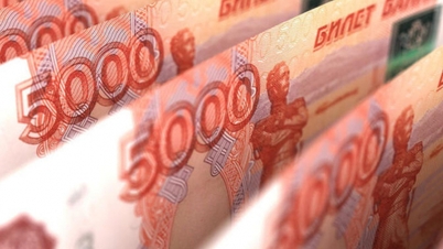 Russian ruble hits one-year low against dollar and yuan