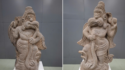 Par de estatuas de Garuda matando serpientes en Thap Mam