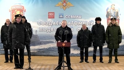 Mr. Putin attends the flag-raising ceremony of two new nuclear submarines