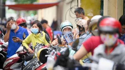 Fearing flooding, many schools in Hanoi let students leave early and study online.