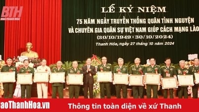 Meeting to celebrate the 75th anniversary of the traditional day of Vietnamese volunteer soldiers and military experts helping the Lao revolution