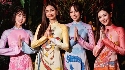 Las bellezas tailandesas visten Ao Dai para el Tet