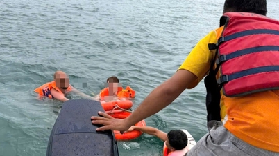 Ausländische Touristen beim Schwimmen am Strand von Nha Trang bei starkem Regen vor dem Ertrinken gerettet