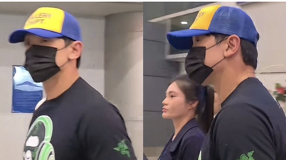 Bi Rain arrive au Vietnam, le visage couvert, mais salue tout de même ses fans avec enthousiasme.