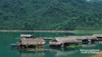 Floating village on hydroelectric reservoir
