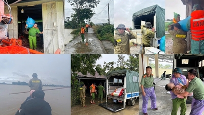 Die Polizei der Gemeinde Nam Da unterstützt die Menschen beim Verlassen des überschwemmten Gebiets.