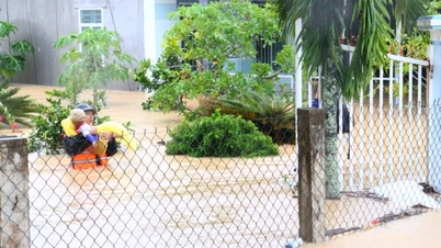 Naval Academy officers and students wade in to help people in floods