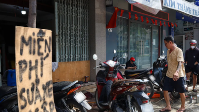 חאן הואה: תיקון חינם של מכשירים אלקטרוניים ואופנועים כדי לעזור לאנשים לאחר שיטפונות