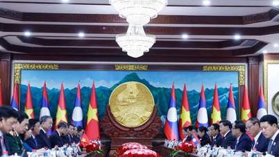 המזכיר הכללי טו לאם היה עד לחילופי מסמכי שיתוף הפעולה בין וייטנאם ללאוס.