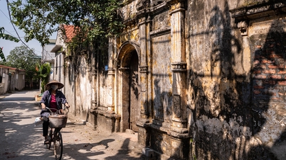 Como é hoje a vila de Hanói que outrora era famosa por sua riqueza, suas inúmeras vilas ocidentais e casas antigas?