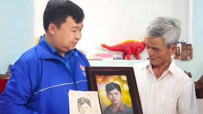 Jugendliche aus Da Nang restaurieren und präsentieren Porträts gefallener Soldaten.