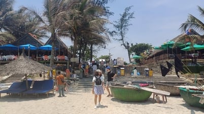 An Bang Beach attracts tourists in hot season