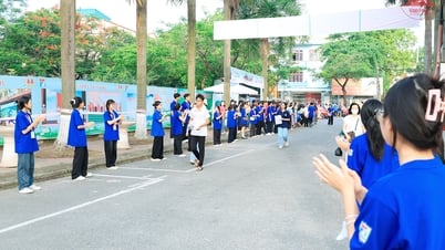 Volunteers in green shirts support candidates for the 10th grade entrance exam