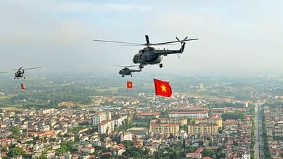 10 trực thăng huấn luyện bay kéo cờ Đảng, cờ Tổ quốc trên bầu trời Hà Nội