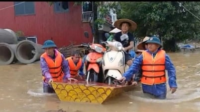 La comuna de Thach That reubica a personas de las zonas inundadas y refuerza las orillas del río Tich.