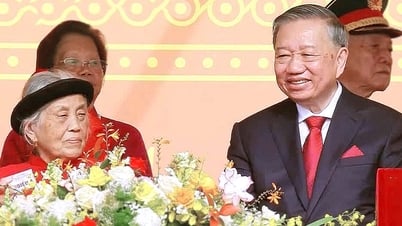 Heroic Vietnamese Mother sits next to General Secretary To Lam at the National Day parade on September 2