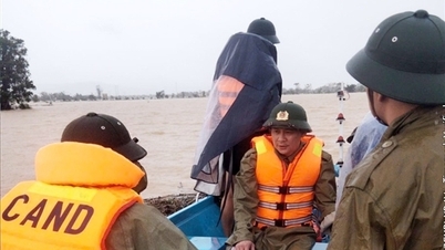 Police used a specialized boat to carry the old woman's body through the flood to be cremated.