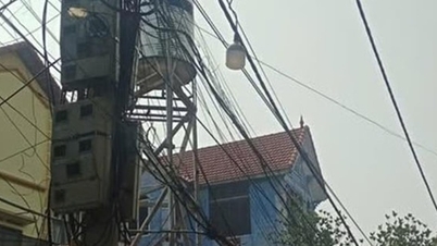 Komune Quang Minh menangani masalah kabel telekomunikasi yang kusut.