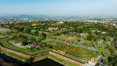 Hue: A giant lotus flower made from 50,000 vibrant flower pots beside the ancient Citadel.
