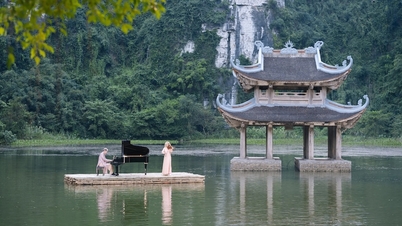 Secret Garden's female performers play traditional Vietnamese ao dai in a picturesque setting in Ninh Binh.