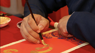 La rue des calligraphes transporte l'atmosphère du Têt traditionnel vietnamien aux habitants d'Hô Chi Minh-Ville.