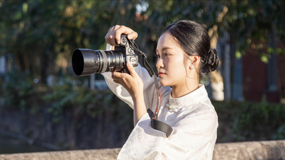 [Photo] Young people in Da Nang radiate the spirit of spring in traditional ao dai dresses.