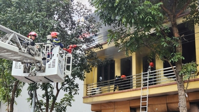 A large fire broke out at a plastics store; police broke down the door and used a fire truck with a ladder to extinguish the flames.