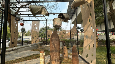 An art exhibition featuring pieces of aircraft wreckage and bomb casings.