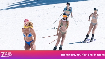 Women flock to ski in melting snow puddles in the US wearing swimsuits.