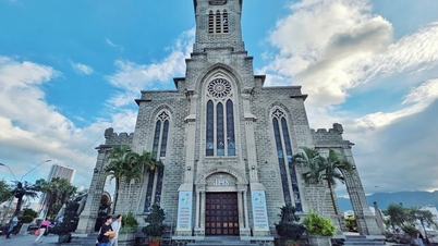 Nha Trang Cathedral - A stone spire rising amidst the sea and sky.