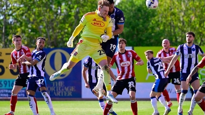 Keeper scorer i det 90+6. minutt, Cardiff sikrer opprykk i en følelsesladet kamp.